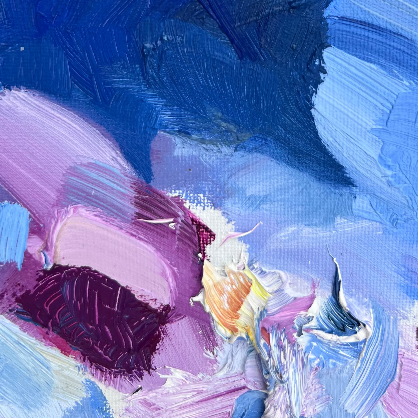 Painterly moments captured in white paint clearly scooped out of on a small non-objective abstract painting previously serving as a palette. Bright blue and cool purples contrast with white paint.